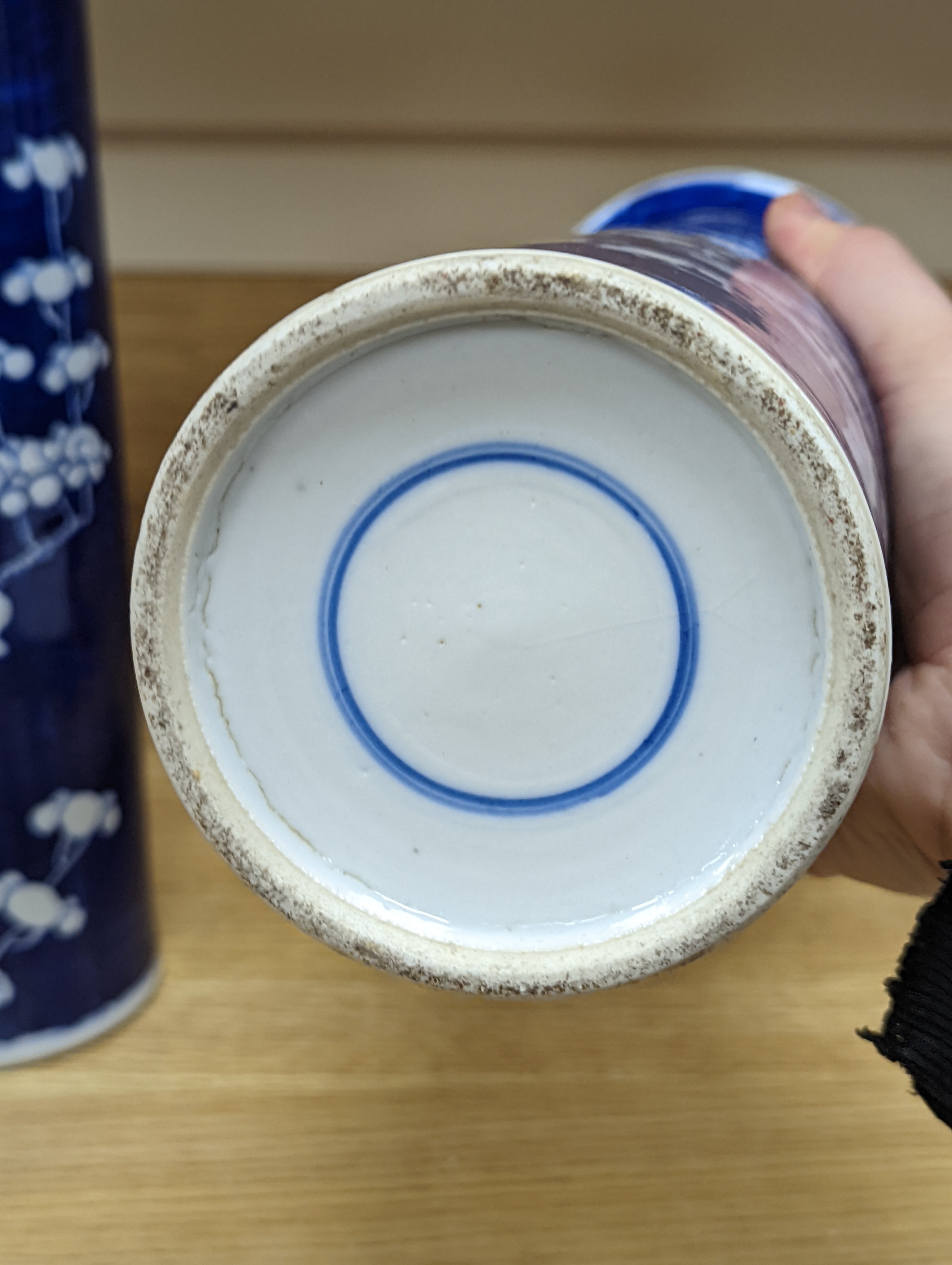 An 18th century Chinese famille rose mug, a Chinese Imari tea caddy and two Chinese blue and white sleeve vases 30cm (4)